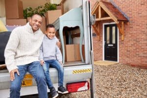 portrait of father and son unloading furniture fro 2024 10 19 14 38 45 utc