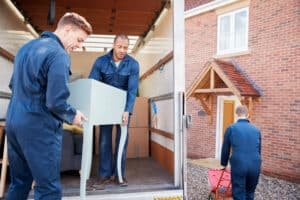 removal company workers unloading furniture and bo 2024 10 21 02 21 04 utc