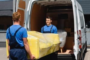 selective focus of movers holding sofa in stretch 2024 11 17 23 58 10 utc